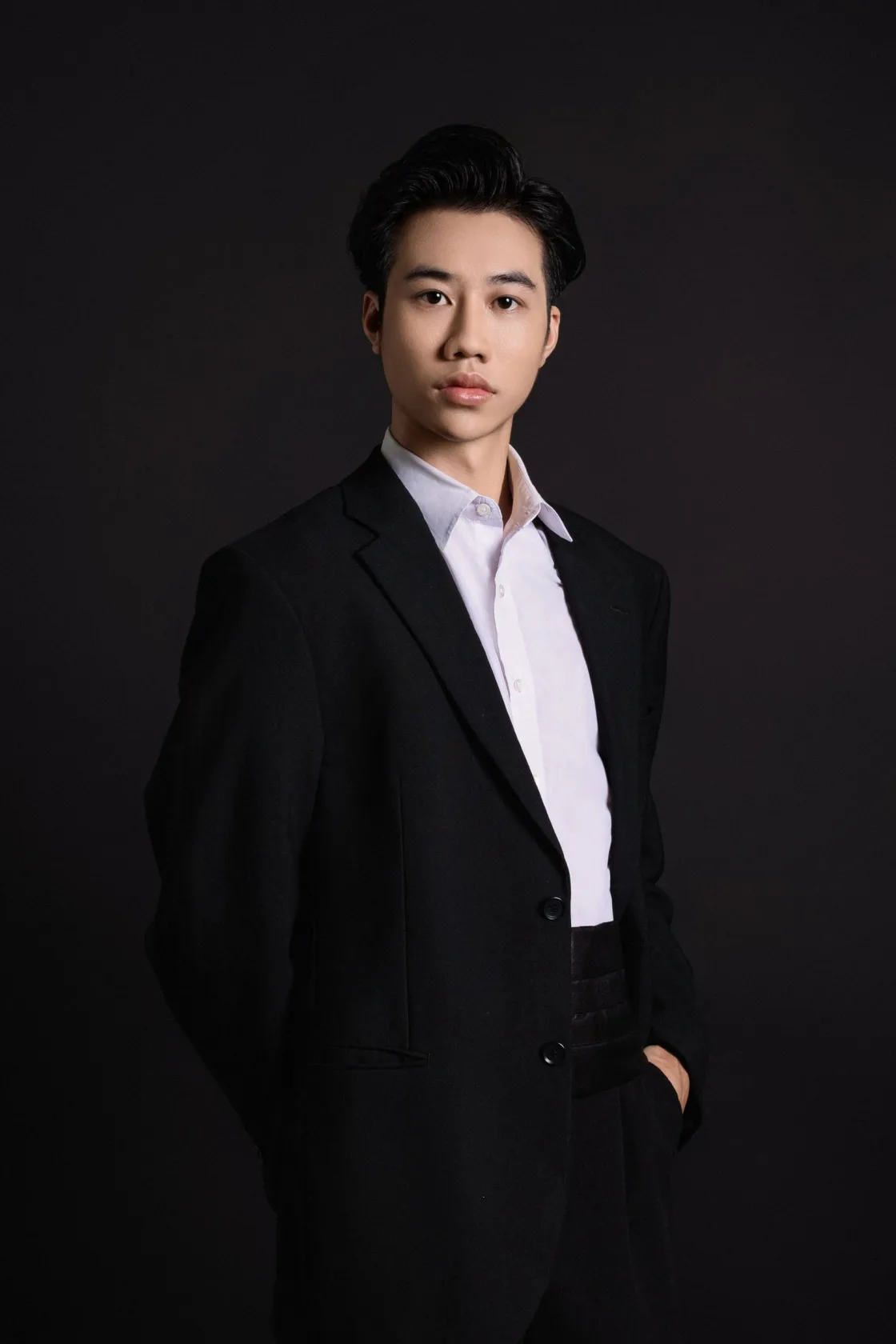 Editorial portrait of a person in a dark setting