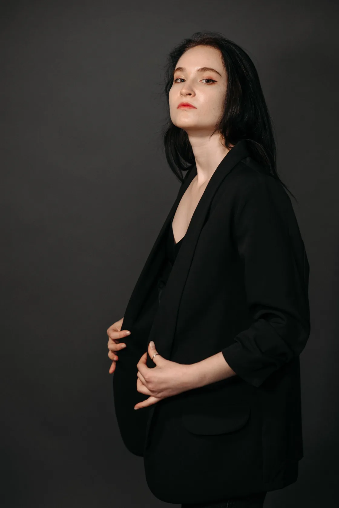 Editorial portrait of a person in a dark setting